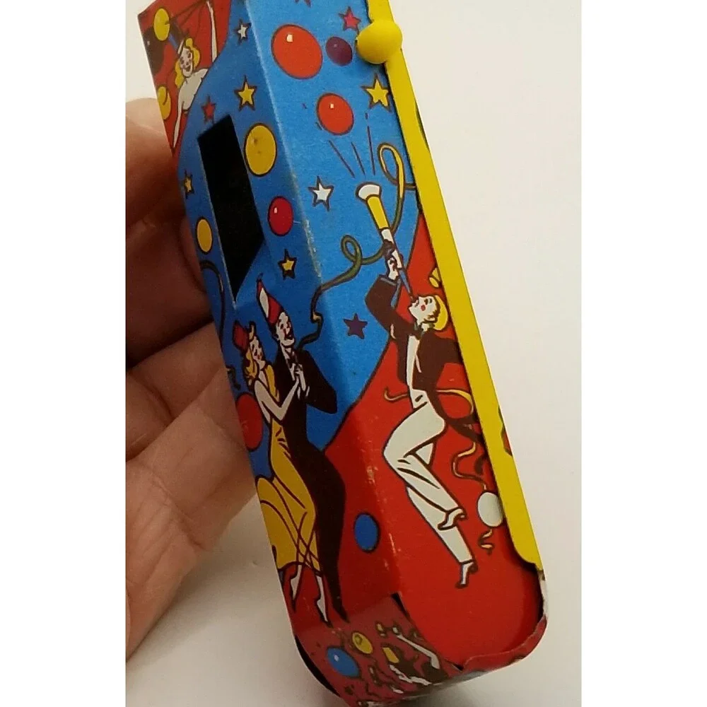 vintage tin lithograph ratchet style US Metal Toy Co noisemaker party theme